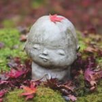 Gardening Meditation Image of a tranquil garden with a person meditating in a serene outdoor setting