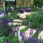 Landscape ideas for a slight sloping front yard: Terrace garden with native plants and stone walkways
