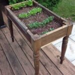 Garden Ideas for Square Gardens Square garden with raised beds and colorful blooms for modern garden ideas